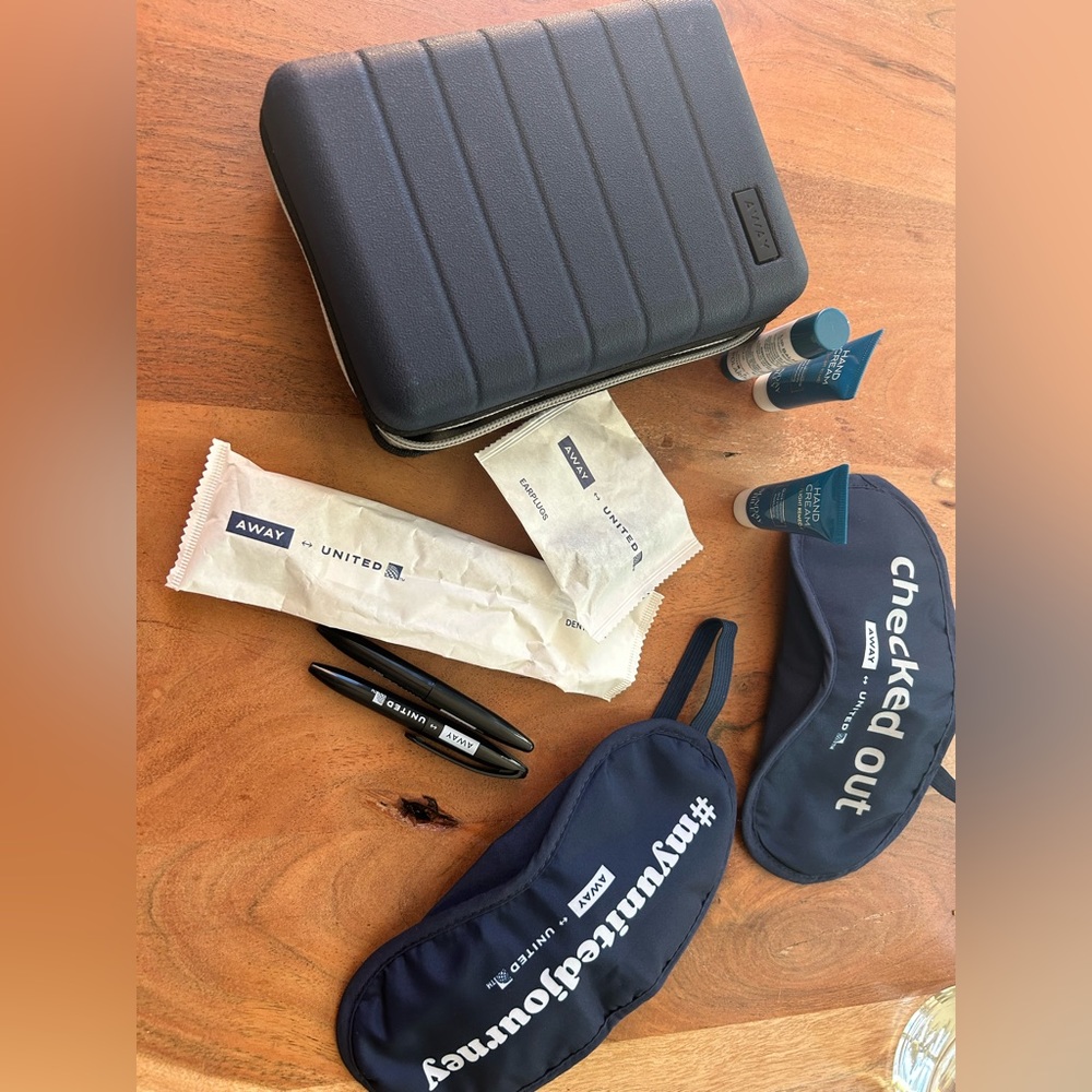 United Away Mini Hard Case Luggage plus amenities